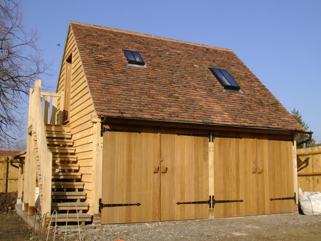 timber frame garage with room extension above