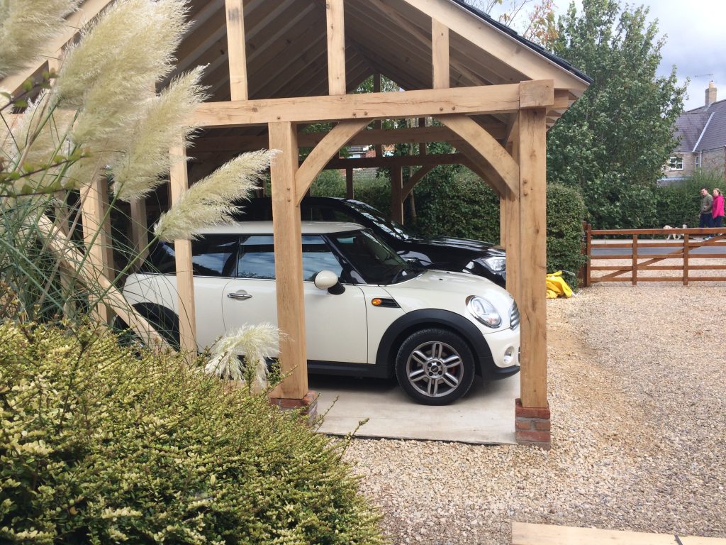 2 cars in a timber carport